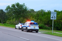 Policeman pulling over a vehicle - Traffic Violations Defense in Indiana